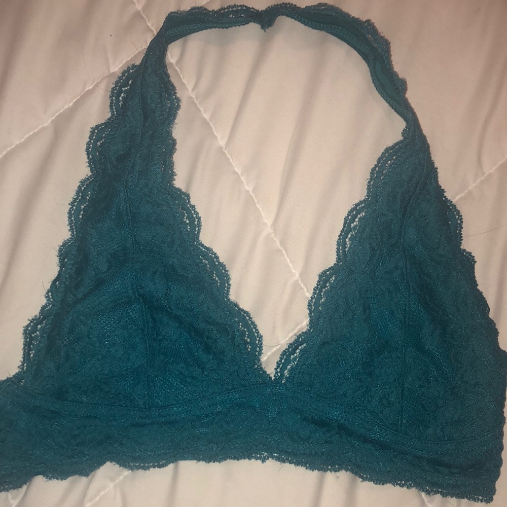 Two identical bralette. one teal one white.